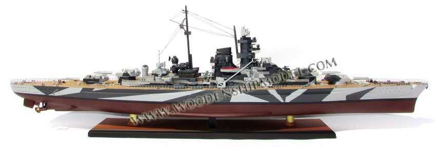 Tirpitz was the second of two Bismarck-class battleships built for Nazi Germany's Kriegsmarine (navy) during World War II. Named after Grand Admiral Alfred von Tirpitz, the architect of the Kaiserliche Marine (Imperial Navy), the ship was laid down at the Kriegsmarinewerft Wilhelmshaven in November 1936 and her hull was launched two and a half years later. Work was completed in February 1941, when she was commissioned into the German fleet. Like her sister ship Bismarck, Tirpitz was armed with a main battery of eight 38-centimeter (15 in) guns in four twin turrets. After a series of wartime modifications she was 2,000 metric tons (2,000 long tons) heavier than Bismarck, making her the heaviest battleship ever built by a European navy